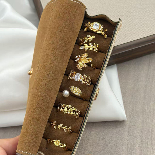 jewelry in a box with gold and silver rings by shuntia symonette